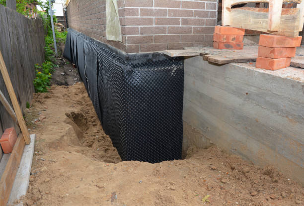 SJ Waterproofing Pros technician performing targeted Exterior Waterproofing assessment in Castalia, OH